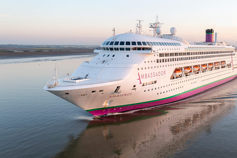 Ambassador Cruise Line Ambience ship sailing on tranquil waters
